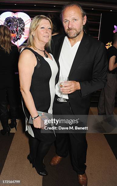 Chris Bracey and guest attend Christian Furr and Chris Bracey 'Staying Alive' Private View at 45 Park Lane on July 3, 2013 in London, England.