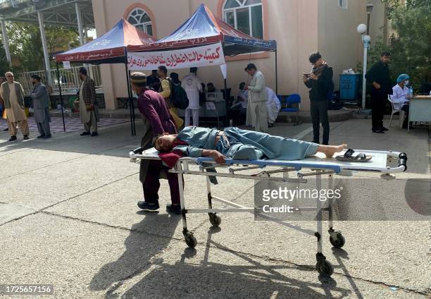 An injured Afghan man being brought to a hospital following earthquake in Herat on October 15, 2023. A magnitude 6.3 earthquake shook western...