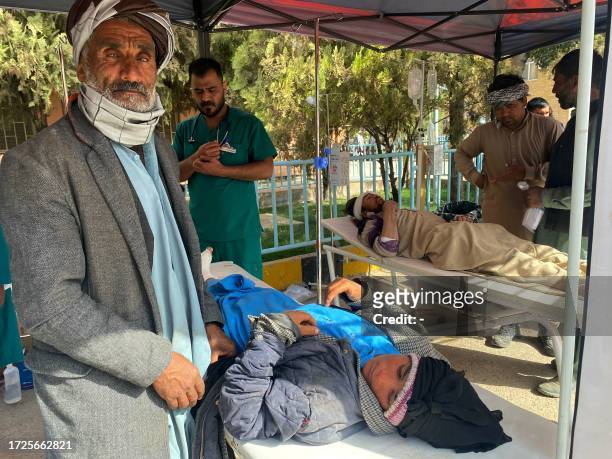 Medic and volunteers attend injured survivors at a hospital following earthquake in Herat on October 15, 2023. A magnitude 6.3 earthquake shook...
