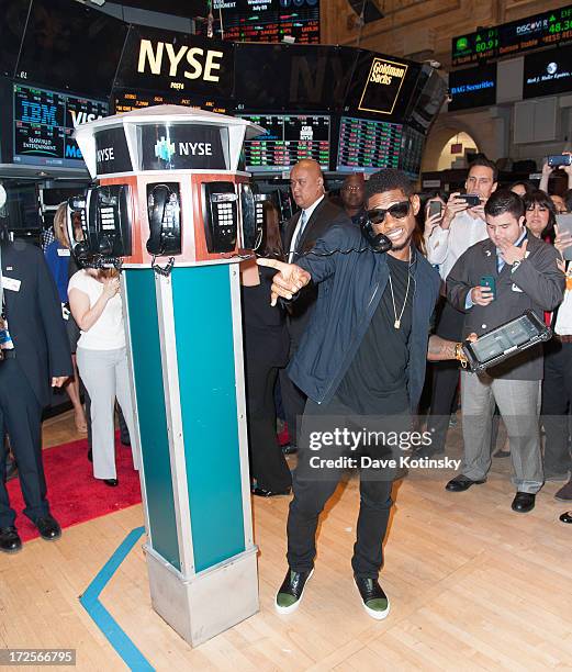 Usher rings the NYSE closing bell at the New York Stock Exchange on July 3, 2013 in New York City.