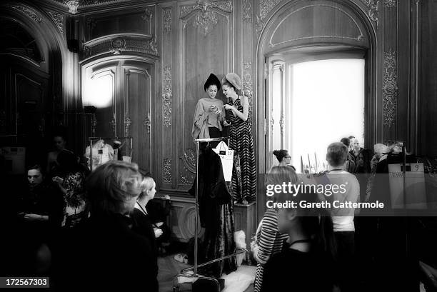 Models take photos backstage before the Julien Fournie show as part of Paris Fashion Week Haute-Couture Fall/Winter 2013-2014 at Artcurial on July 2,...