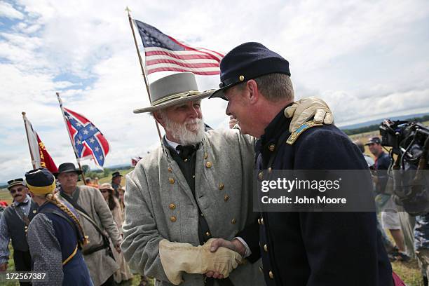 General Lee" greets a Union soldier following a re-enactment of Pickett's Charge on the 150th anniversary of the historic Battle of Gettysburg on...