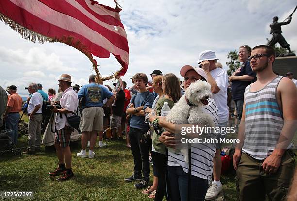 People watch from the Cemetery Hill as thousands of people re-enact Pickett's Charge on the 150th anniversary of the historic Battle of Gettysburg on...