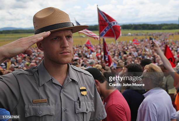 National Park Ranger salutes during the playing of "Taps" following a re-enactment of Pickett's Charge on the 150th anniversary of the historic...