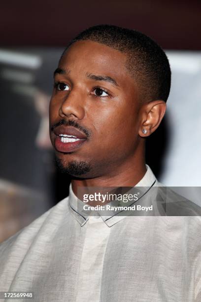 Actor Michael B. Jordan, poses for photos during the red carpet arrivals for the "Fruitvale Station" movie screening at the Showplace ICON Theatres...