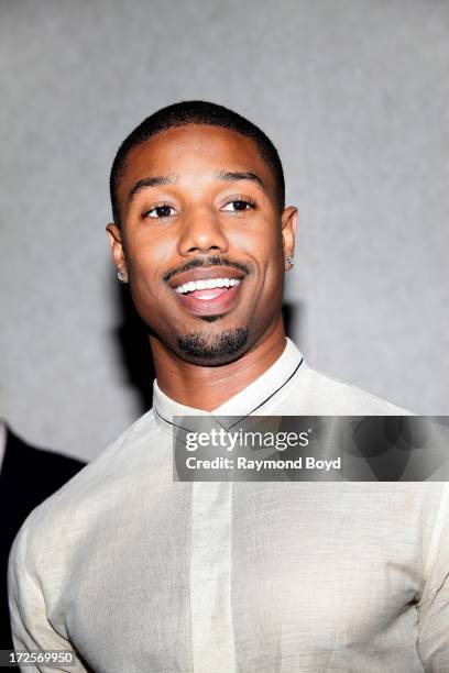 Actor Michael B. Jordan, poses for photos during the red carpet arrivals for the "Fruitvale Station" movie screening at the Showplace ICON Theatres...