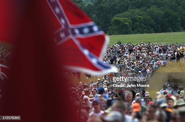 Thousands of civilians take part in a re-enactment of Pickett's Charge on the 150th anniversary of the historic Battle of Gettysburg on July 3, 2013...