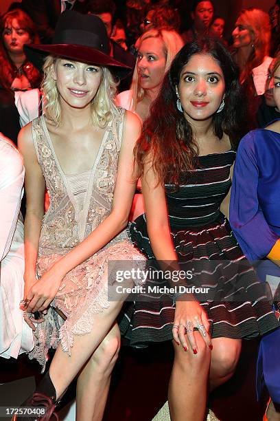 Elena Perminova and Noor Fares attend the Elie Saab show as part of Paris Fashion Week Haute-Couture Fall/Winter 2013-2014 at Palais Brongniart on...