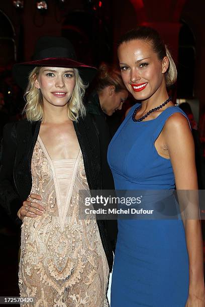 Elena Perminova and Petra Nemcova attend the Elie Saab show as part of Paris Fashion Week Haute-Couture Fall/Winter 2013-2014 at Palais Brongniart on...