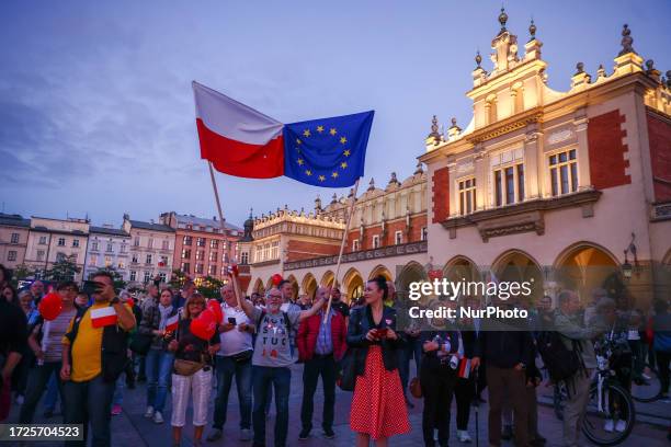People demonstrate supporting opposition parties during an anti-government protest two days ahead of parliamentary elections at the Main Square in...