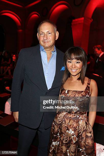 John Dempsey and his wife attend the Elie Saab show as part of Paris Fashion Week Haute-Couture Fall/Winter 2013-2014 at Palais Brongniart on July 3,...