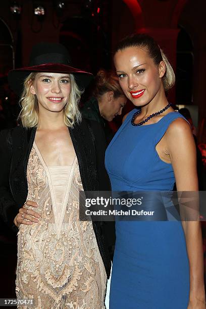 Elena Perminova and Petra Nemcova attend the Elie Saab show as part of Paris Fashion Week Haute-Couture Fall/Winter 2013-2014 at Palais Brongniart on...