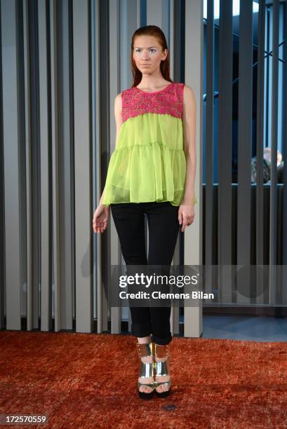 Model walks the runway at Simone Anes & Stephan Pelger Show during Mercedes-Benz Fashion Week Spring/Summer 2014 on July 3, 2013 in Berlin, Germany.