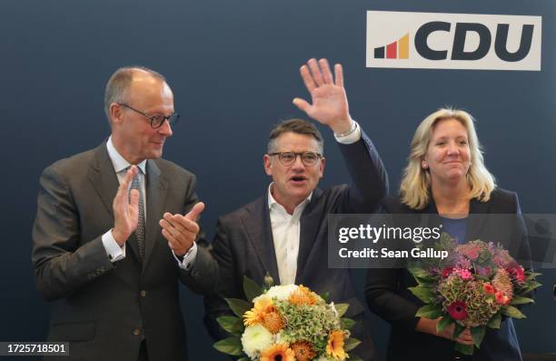 Friedrich Merz , leader of the German Christian Democrats , welcomes Boris Rhein , incumbent and lead CDU candidate in the state of Hesse, at CDU...