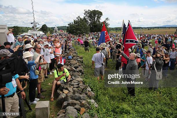 Civil War re-enactors and civilians take part in a re-enactment of Pickett's Charge on the 150th anniversary of the historic Battle of Gettysburg on...