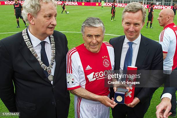 Major Eberhard van der Laan of Amsterdam, Sjaak Swart with medal of honour, alderman Eric van der Burg of Amsterdam during the Sjaak Swart 75th...