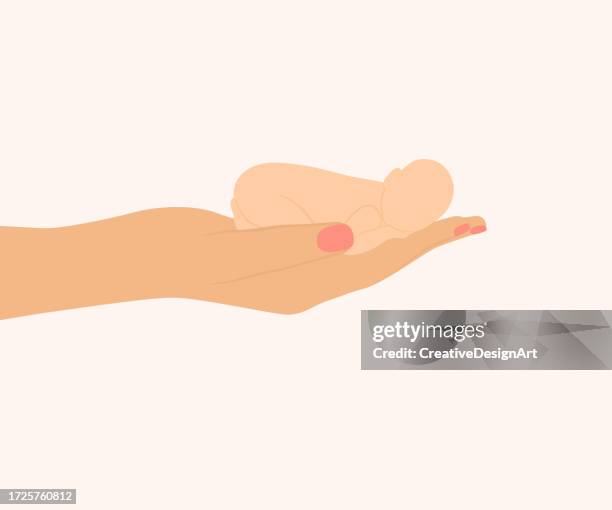 side view of hand holding premature newborn baby. world prematurity day - premature stock illustrations
