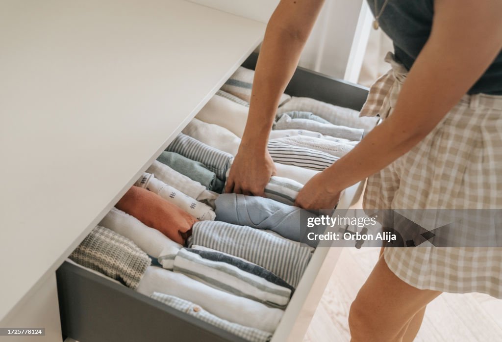 Woman folding clothes