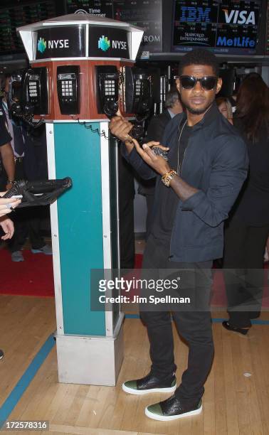 Singer Usher rings the closing bell at the New York Stock Exchange on July 3, 2013 in New York City.