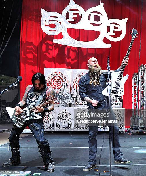 Jason Hook and Chris Kael of Five Finger Death Punch perform at the Rockstar Energy Drink Mayhem Festival on June 30, 2013 in San Francisco,...