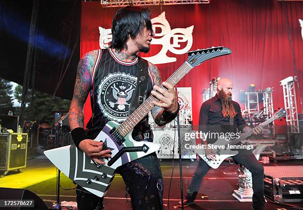 Jason Hook and Chris Kael of Five Finger Death Punch perform at the Rockstar Energy Drink Mayhem Festival on June 30, 2013 in San Francisco,...