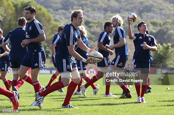 Alun Wyn Jones, the Lions captain, passes the ball during a British and Irish Lions training session at Noosa Dolphins RFA on July 4, 2013 in Noosa,...