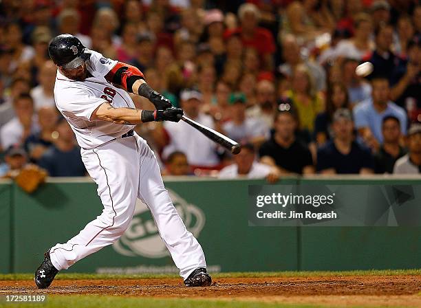 Jonny Gomes of the Boston Red Sox hits a walk-off home run from a pitch by Victor Rodriguez of the Boston Red Sox to give the Red Sox a 2-1 win...