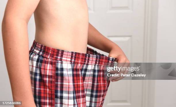 boy with weight loss - white shorts stock pictures, royalty-free photos & images