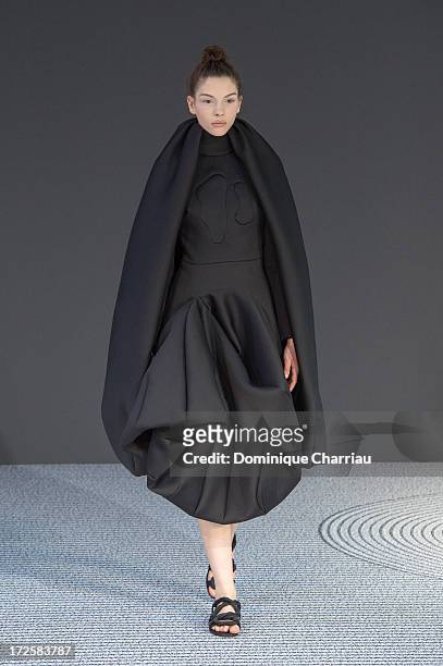 Model walks the runway during the Viktor&Rolf show as part of Paris Fashion Week Haute-Couture Fall/Winter 2013-2014 at La Gaite Lyrique on July 3,...