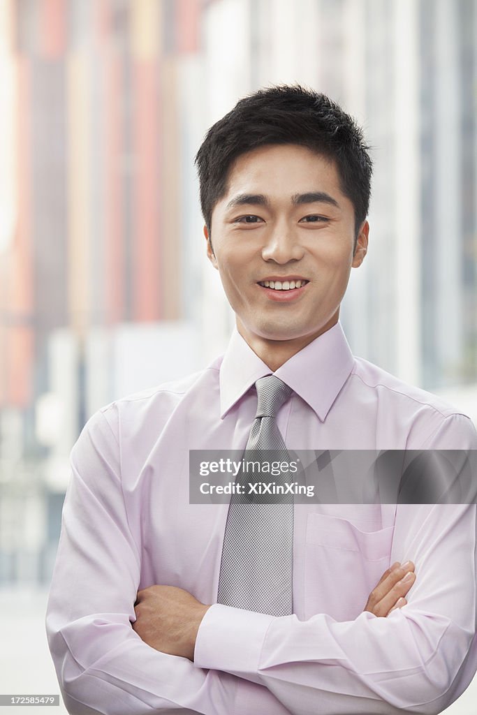 Portrait of smiling young businessman