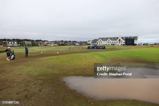Grant Forrest of Scotland chips onto the 16th green as water sits on the course during Round Three on Day Five of the Alfred Dunhill Links...