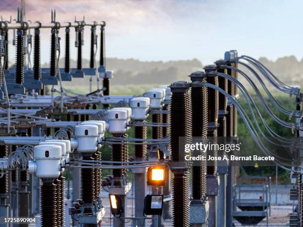 general view of a power distribution power plant at sunset. - gerador imagens e fotografias de stock