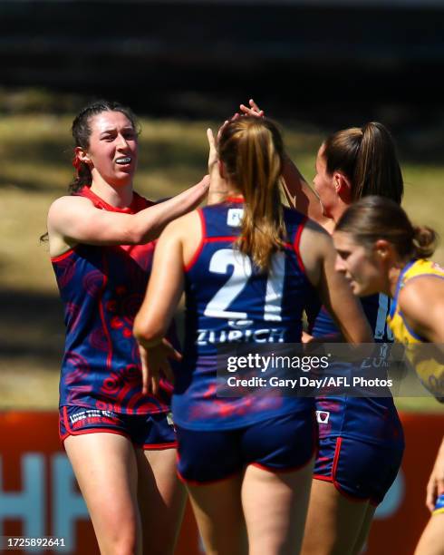 Alyssa Bannan of the Demons celebrates a goal with teammates during the 2023 AFLW Round 07 match between the West Coast Eagles and Naarm at Mineral...