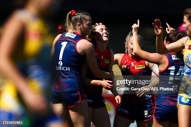 Aimee Mackin of the Demons celebrates a goal with teammates during the 2023 AFLW Round 07 match between the West Coast Eagles and Naarm at Mineral...