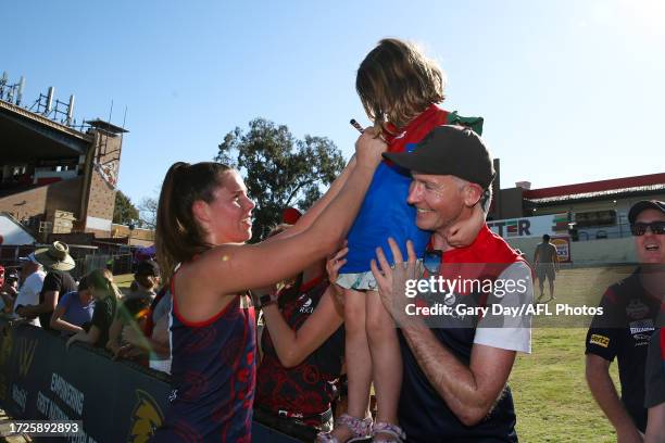 Kate Hore of the Demons signs an autograph during the 2023 AFLW Round 07 match between the West Coast Eagles and Naarm at Mineral Resources Park on...