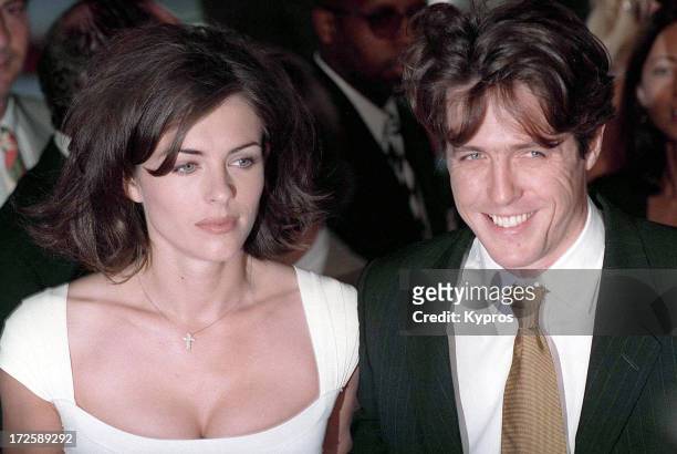 English actors Hugh Grant and Liz Hurley at the Los Angeles premiere of 'Nine Months', 11th July 1995.