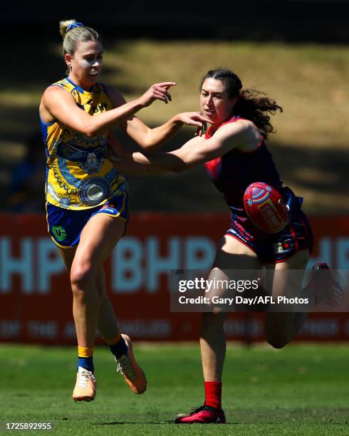 Eleanor Hartill of the Eagles and Alyssa Bannan of the Demons compete for the ball during the 2023 AFLW Round 07 match between the West Coast Eagles...