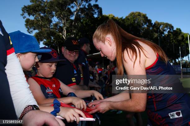 Blaithin Mackin of the Demons signs an autograph during the 2023 AFLW Round 07 match between the West Coast Eagles and Naarm at Mineral Resources...