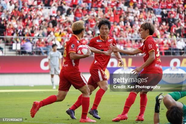 Kensuke Nagai of Nagoya Grampus celebrates the equaliser with Sho Inagaki and Haruki Yoshida of Nagoya Grampus, but later cancelled by off-side...