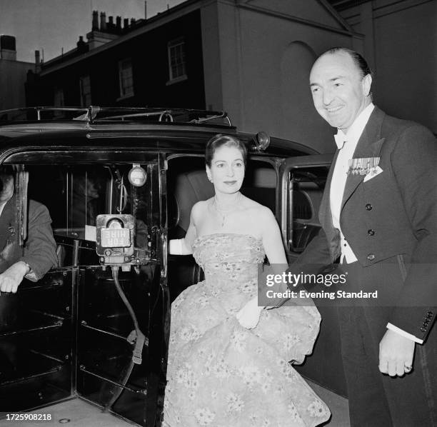 British Foreign Minister John Profumo and his wife, former actress Valerie Hobson , arriving at an event by taxi, May 21st 1959.