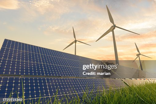 Solar panels and wind turbines under sunlight Solar panels and wind turbines under sunlight