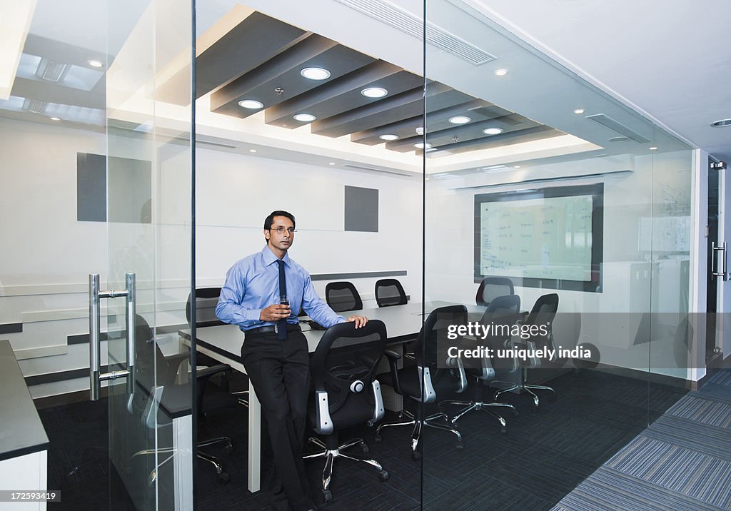 Businessman standing in a conference room