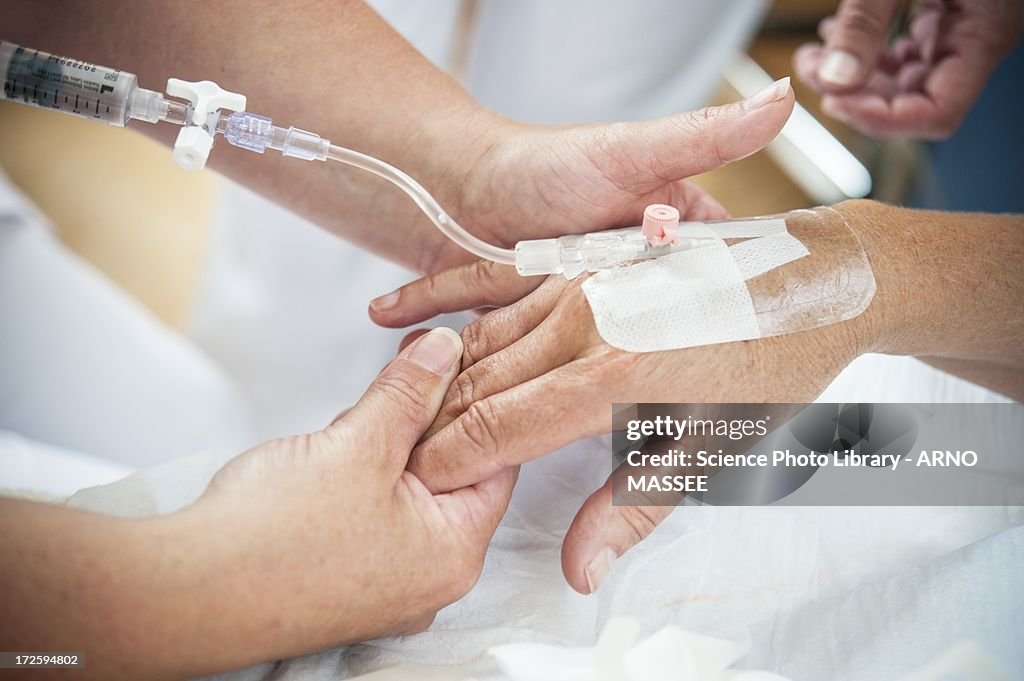 Nurse preparing a patient for an IV line