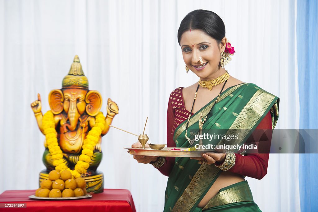 Maharashtrian Woman Holding A Puja Thali During Ganesh Chaturthi Festival  High-Res Stock Photo - Getty Images