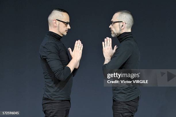 Viktor Horsting and Rolf Snoeren walk the runway during the Viktor&Rolf show as part of Paris Fashion Week Haute-Couture Fall/Winter 2013-2014 on...