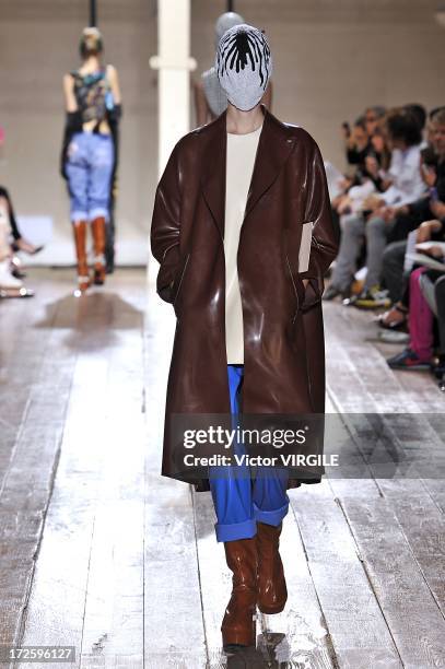 Model walks the runway during the Maison Martin Margiela show as part of Paris Fashion Week Haute-Couture Fall/Winter 2013-2014 on July 3, 2013 in...