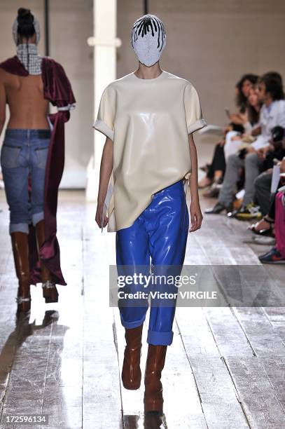 Model walks the runway during the Maison Martin Margiela show as part of Paris Fashion Week Haute-Couture Fall/Winter 2013-2014 on July 3, 2013 in...