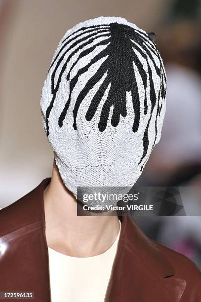 Model walks the runway during the Maison Martin Margiela show as part of Paris Fashion Week Haute-Couture Fall/Winter 2013-2014 on July 3, 2013 in...