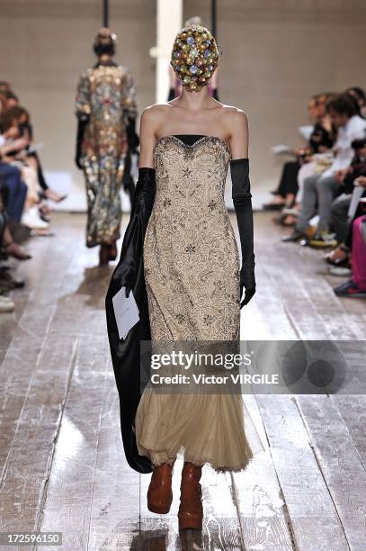 Model walks the runway during the Maison Martin Margiela show as part of Paris Fashion Week Haute-Couture Fall/Winter 2013-2014 on July 3, 2013 in...