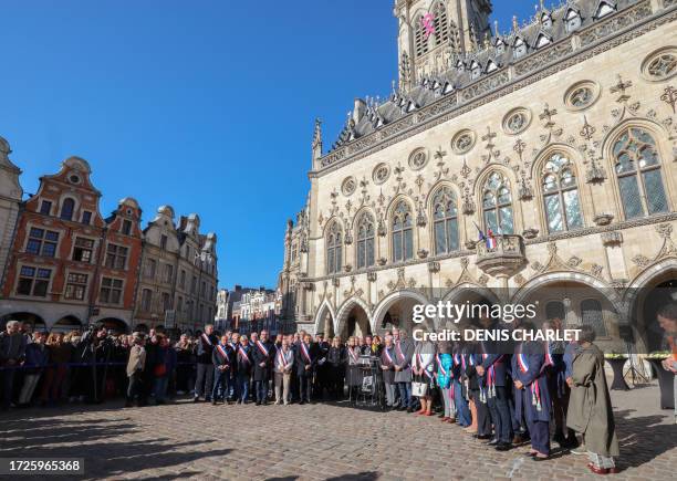 Mayor of Arras Frederic Leturque listens to the departemental manager of the first union for high-schools Catherine Piecuche delivering a speech as...